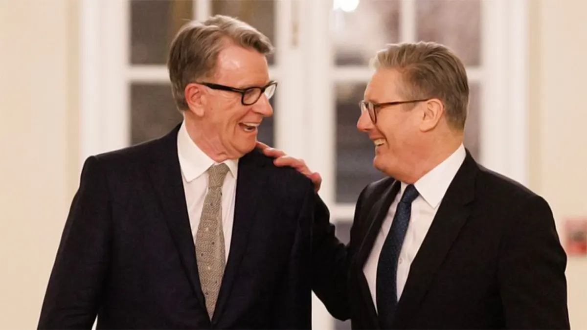 Peter Mandelson (left) laughing and placing a hand on the shoulder of Prime Minister Keir Starmer (right) in a formal setting before the 2025 scandal.