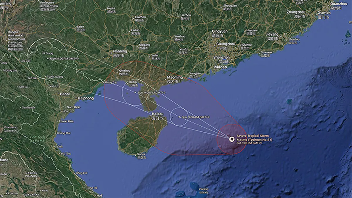 A satellite weather map displaying the projected path and cone of uncertainty for Severe Tropical Storm Matmo (Typhoon No. 21) as it heads toward Hainan Island and southern China.
