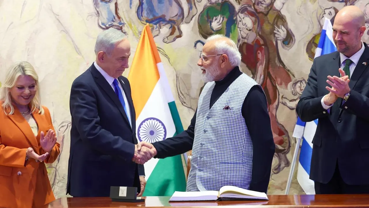 Indian Prime Minister Narendra Modi and Israeli Prime Minister Benjamin Netanyahu shaking hands at the Knesset in Jerusalem during the February 2026 state visit, with Sara Netanyahu and Speaker Amir Ohana looking on
