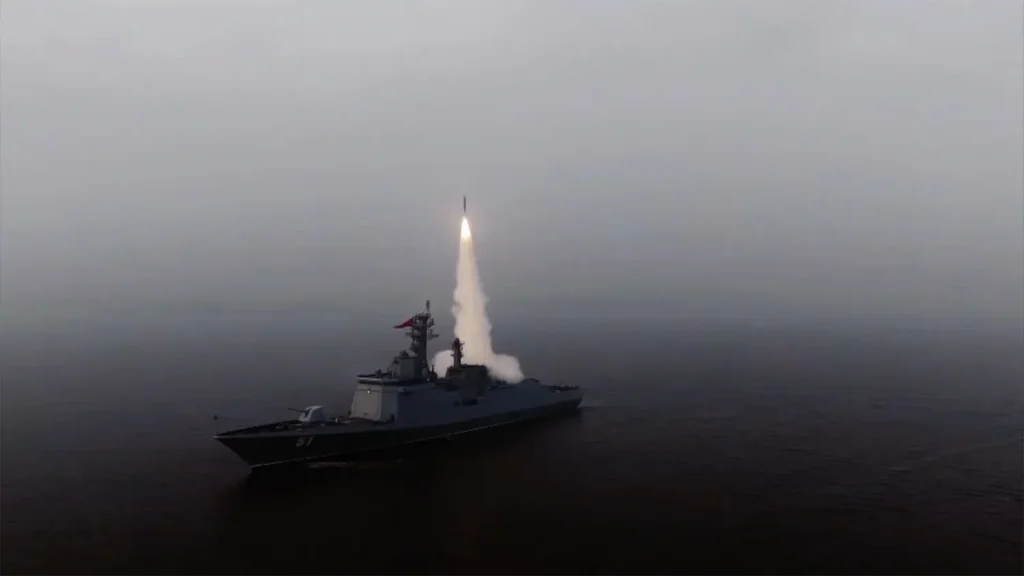 A North Korean naval frigate launches a Hwasal-Ra-3 strategic cruise missile into a foggy sky during the April 2026 power tests.