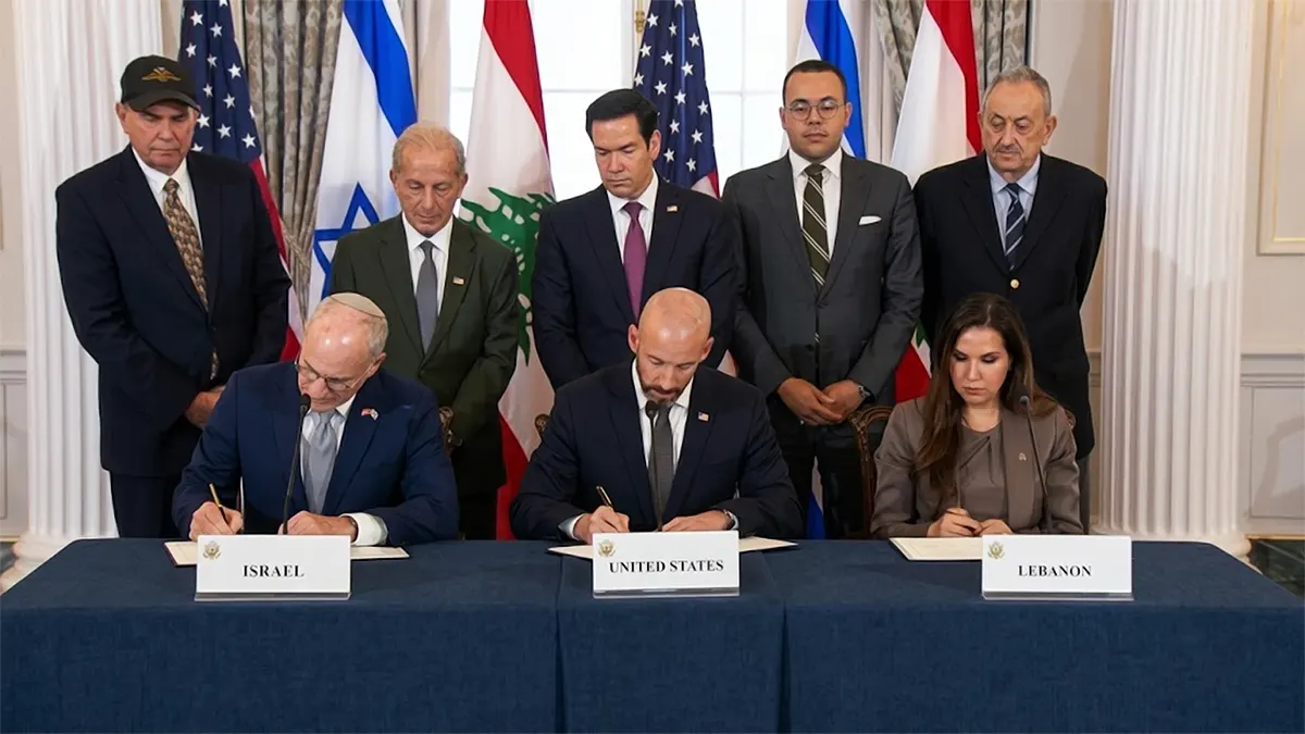 Official signing ceremony of the 2026 Israel-Lebanon Trilateral Framework Agreement in Washington, showing Israeli, US, and Lebanese delegates seated at a table with national flags in the background.