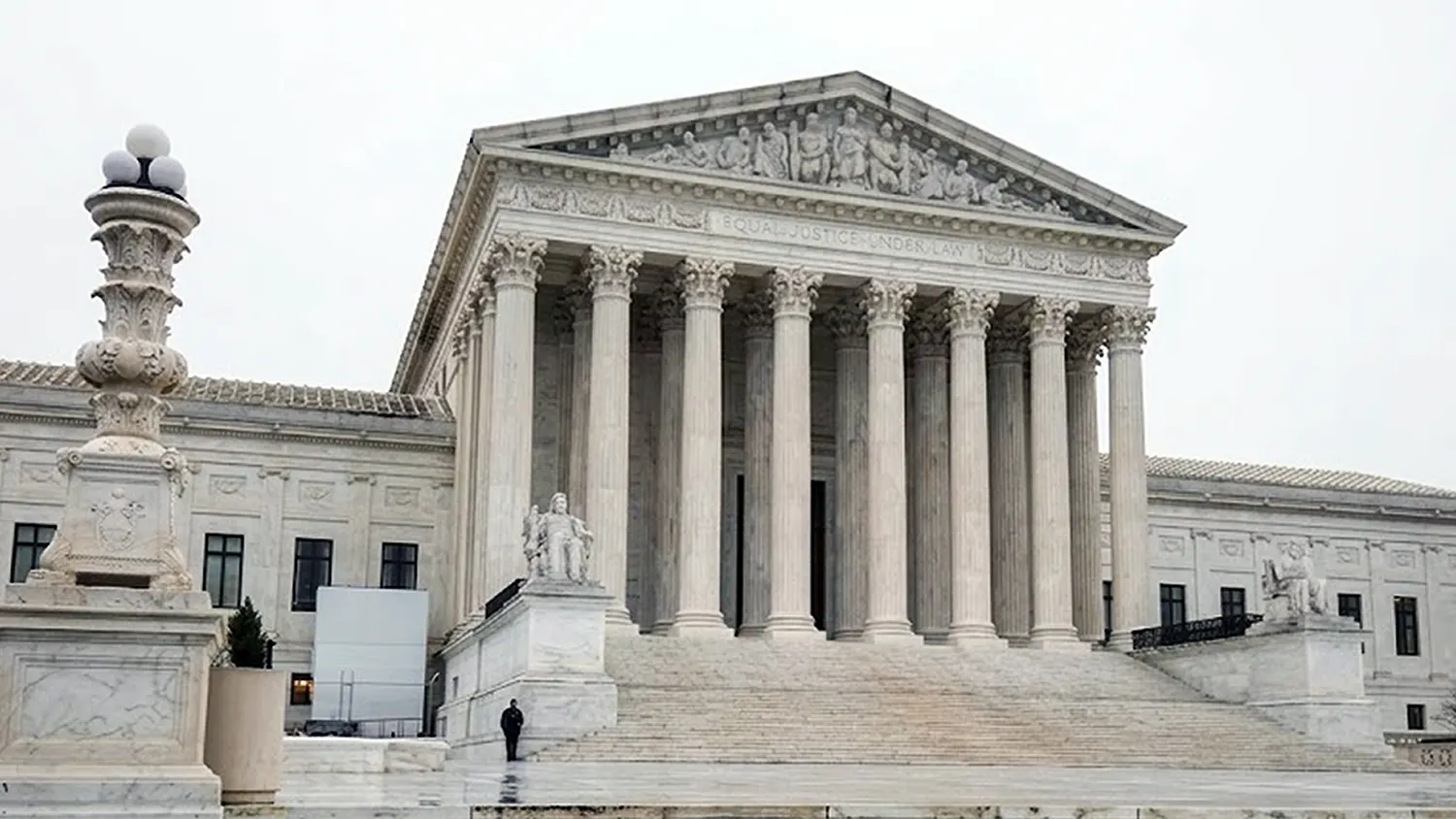 The marble facade and Corinthian columns of the United States Supreme Court building in Washington DC