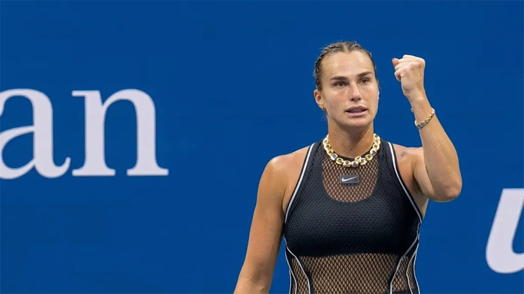 Aryna Sabalenka clenching her fist in celebration during her US Open tennis match victory