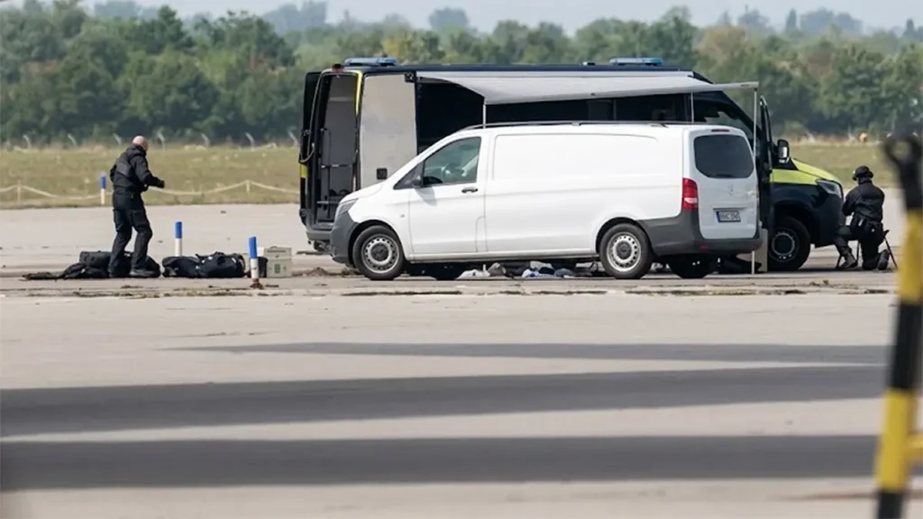 German law enforcement and emergency vehicles investigating an airfield operational scene at Leipzig/Halle Airport.